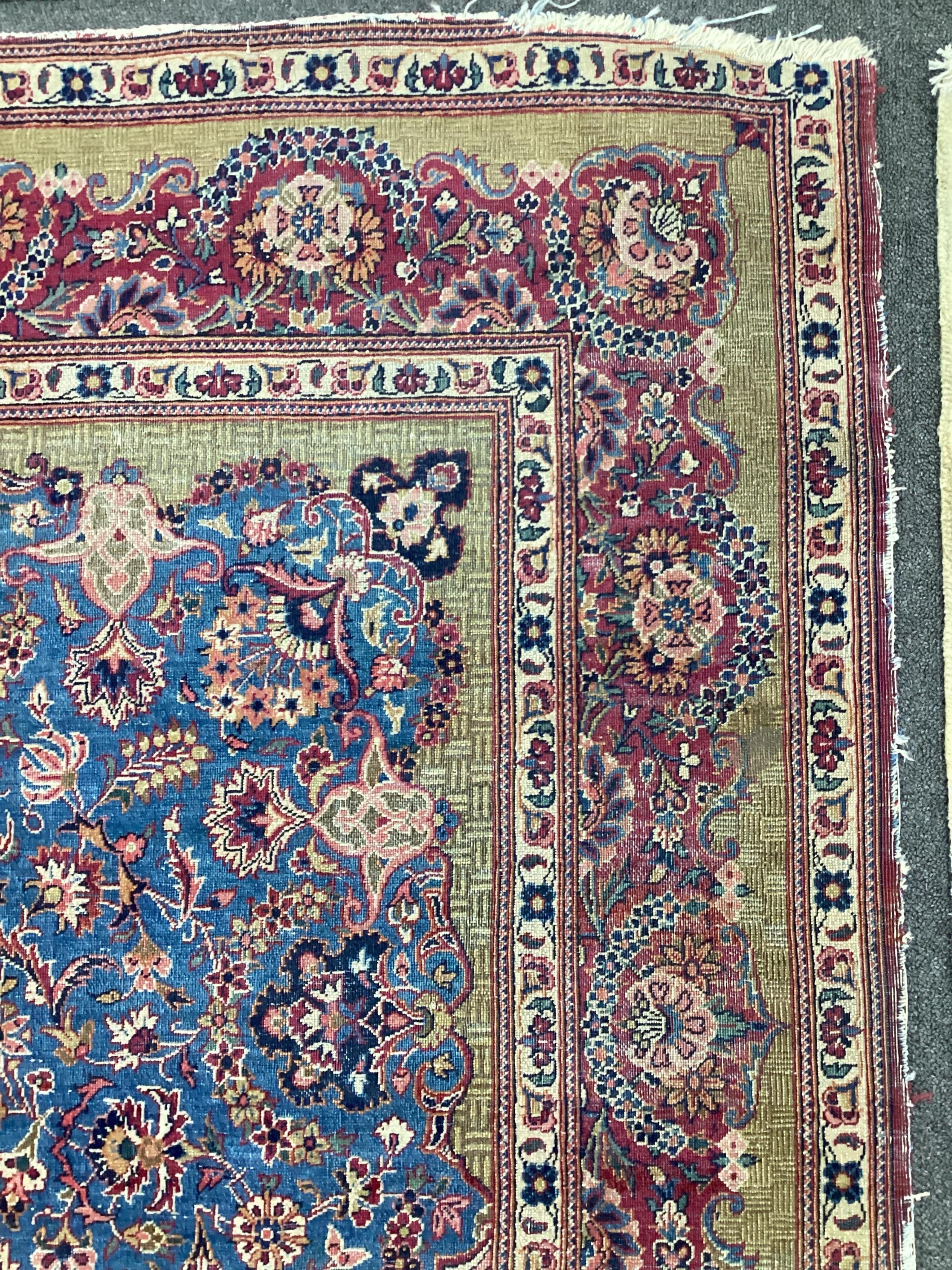 A Kashan blue ground rug, 214 x 128cm. Condition - fair